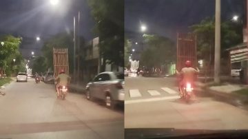Una cama en una moto: filman un imprudente traslado en Avenida Colón